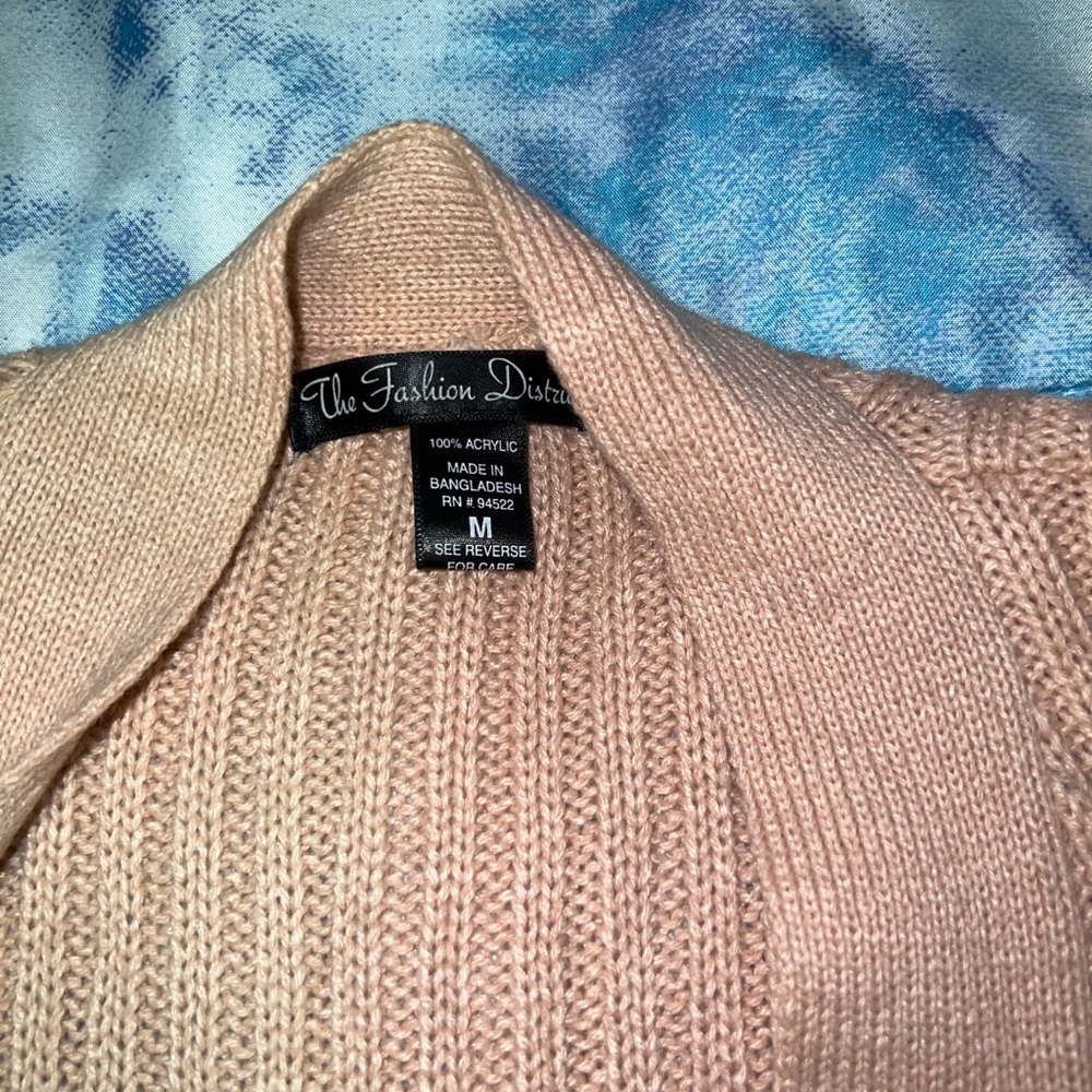 Coral color cardigan. Worn a few times and BOUGHT FROM CHARLOTTE RUSSE.